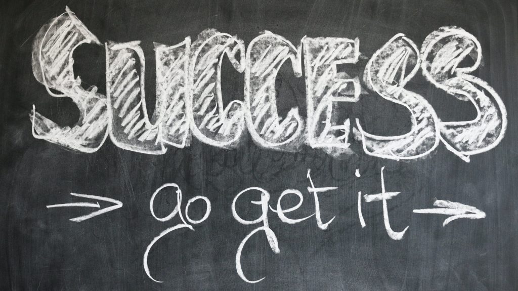 Blackboard with 'success go get it' written in chalk