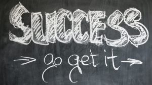 Blackboard with 'success go get it' written in chalk