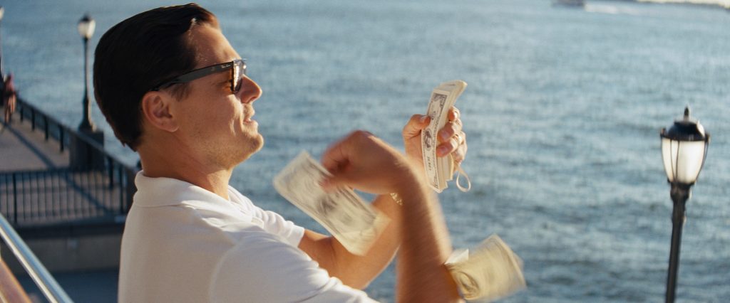 Leonardo DiCaprio throwing money in The Wolf Of Wall Street